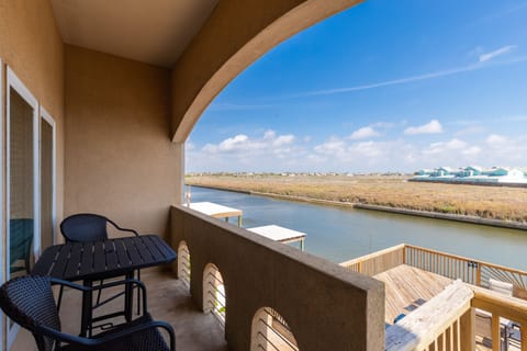 Step onto your private balcony where morning coffee feels magical with sweeping water views and endless blue skies stretching beyond.