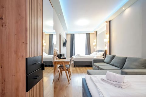Premium bedding, down comforters, free minibar items, in-room safe