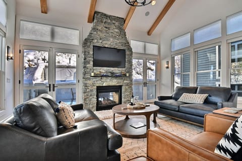 living room with hot tub patio out glass doors