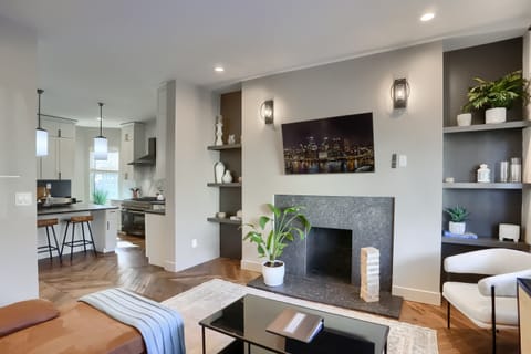 Step into this welcoming living area,  seamlessly flowing in the chef's kitchen.