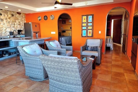 Dramatic natural stone walls, lots of light, and a floor to ceiling full length sliding glass door leads onto the private terrace. Enjoy the ocean views, and breezes that flow through the apartment. The pool and shared lounge areas are steps away. 