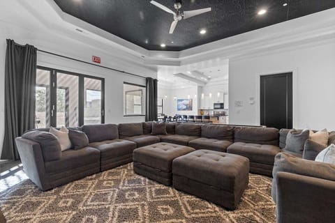 Indulge in the Living Room, where the large sectional beckons you to sink in and rejuvenate after a long day full of adventure and play.