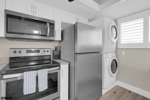 New appliances include a dishwasher and a stackable washer and dryer