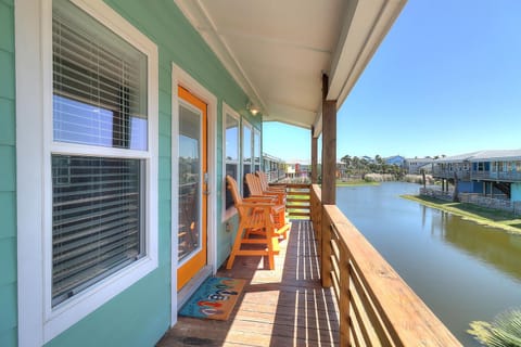 Settle into your waterfront deck chairs and soak up serene canal views from your private covered balcony.