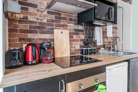 The Atelier/ Superior suite with double to quadruple occupancy featuring a dining area | Private kitchen | Espresso maker, coffee/tea maker, electric kettle, highchair