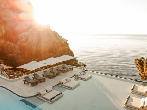 Outdoor pool, open 8:00 AM to 6:00 PM, free cabanas, pool umbrellas