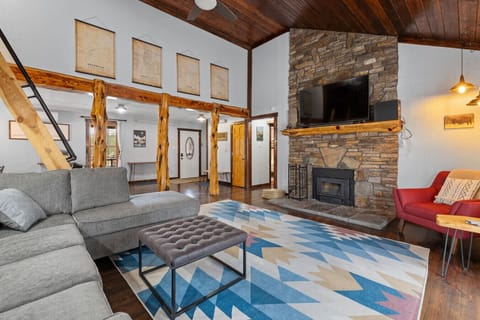 Enjoy a comfortable living area with a plush sleeper sofa bed, providing both a relaxing space to gather and a convenient sleeping option.