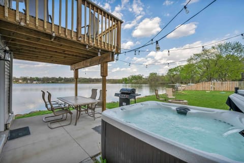 Soak in the hot tub on the deck w/ sweeping water views all around.
