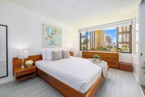Bedroom with King-size bed, night stands and dresser