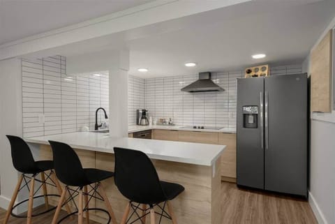 Stay in My District St Johns! Belly up to the bar with additional seating for (4)