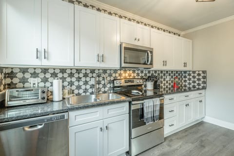 Stocked with toaster oven, crockpot, mini waffle maker, large skillet, etc.