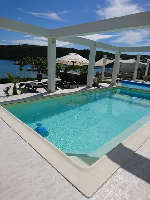 Apartment (One Bedroom apartment with sea view) | Pool | Seasonal outdoor pool, pool umbrellas, sun loungers
