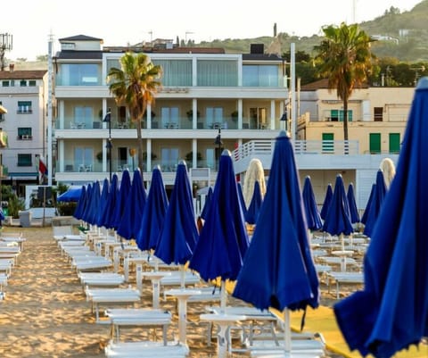 Private beach, white sand, sun loungers, beach umbrellas