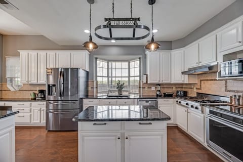 Undeniably the heart of the home with plenty of counter space, this kitchen was made for socializing and entertaining.