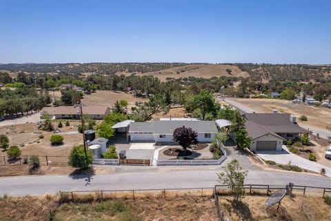 Open acreage and rolling hills set a calm backdrop