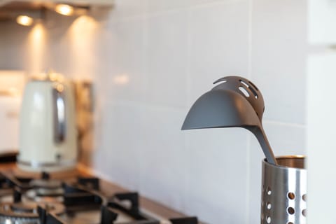 Comfort Apartment | Private kitchen | Highchair, dining tables