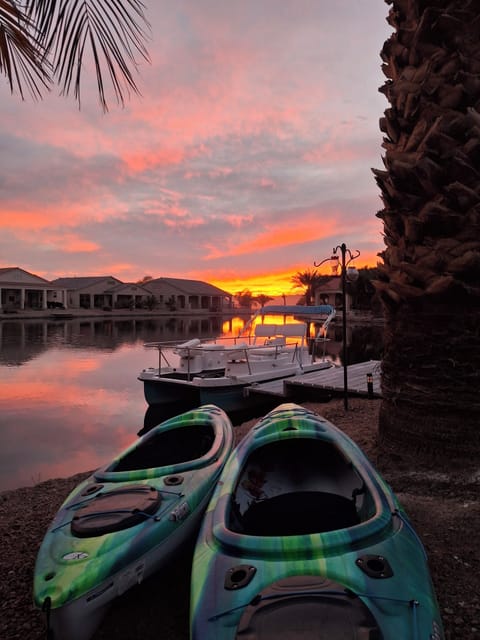 back yard at sunset. 2 kayaks 