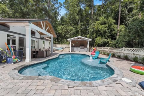Various pool toys and floaties.  Fully fenced in for your furry children. 