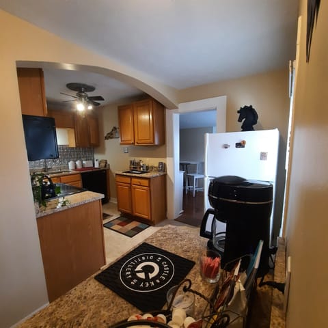 Kitchen is next to the game room.