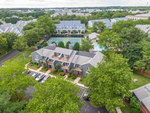 Aerial view of Eagles Landing — lush, park-like grounds, 3 pools, tennis, and pickleball, just minutes from the Rehoboth Beach Boardwalk.