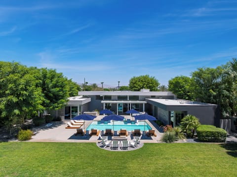 Gather around the lawn fire pit, with the private pool, spa, and ample loungers just beyond.