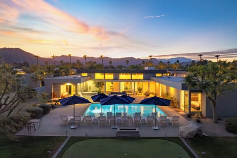 Unwind in the expansive pool & spa area, complete with a fire pit.