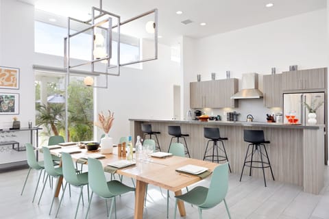 Stunning interior design a chic dining area and chef's kitchen.