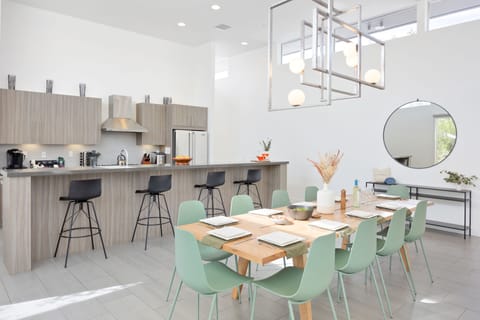 Additional barstool seating at the counter behind the dining area.