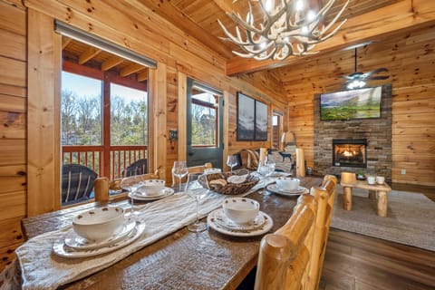 Enjoy Dinner with a view on the dining set that seats six in Sevierville
