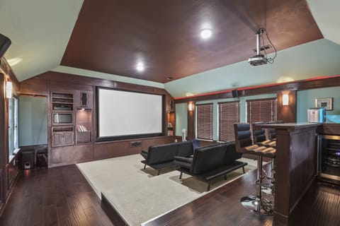 media room with 121 inch screen and bar 