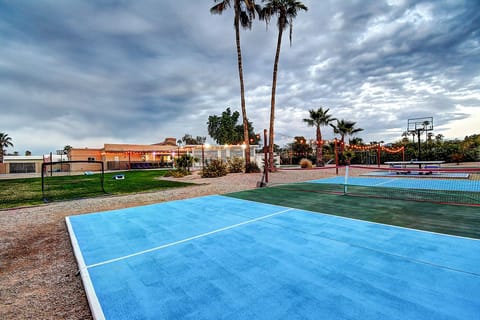 Enjoy your own acre estate with pickleball and more with nighttime party lights.