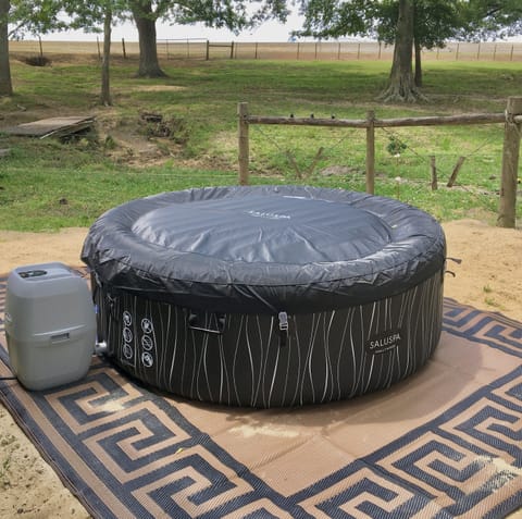 Private hot tub behind Cottage.