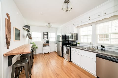 Sunny kitchen has everything you need to cook meals.