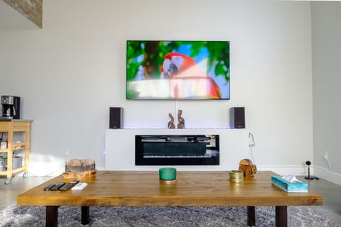 Living room with 75" Sony TV and stereo Klipsch sound system 