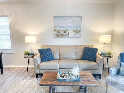 Main floor living room with lower balcony access. (1)