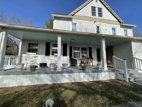 Renovated 7 bedroom farmhouse with front porch for rocking away the day. 