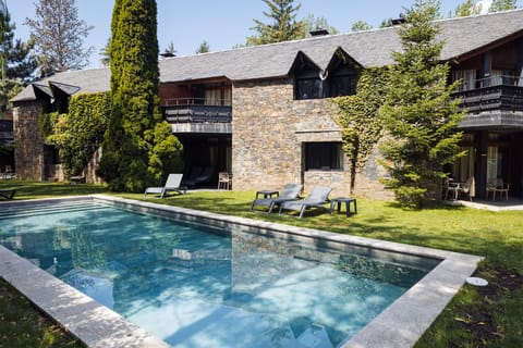 Seasonal outdoor pool, open 9:00 AM to 9:00 PM, pool umbrellas