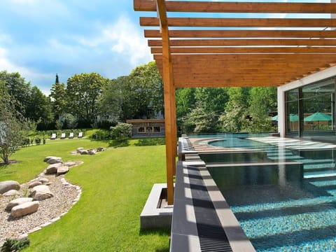 Indoor pool, outdoor pool, pool umbrellas, sun loungers