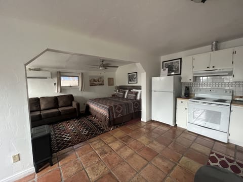 Ground level studio apartment with fully stocked kitchen including coffee.
