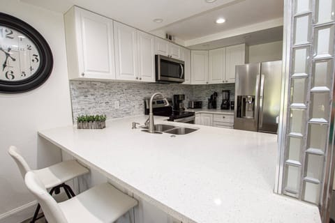 Kitchen has lots of calming gray tones throughout!
