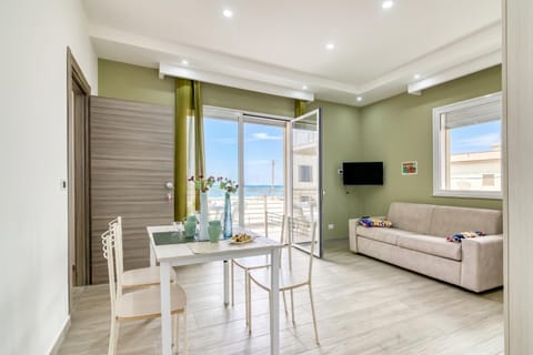Family Apartment, 1 Bedroom, Balcony, Sea Facing (Corallo House 200m From The Sea) | Living area | Flat-screen TV