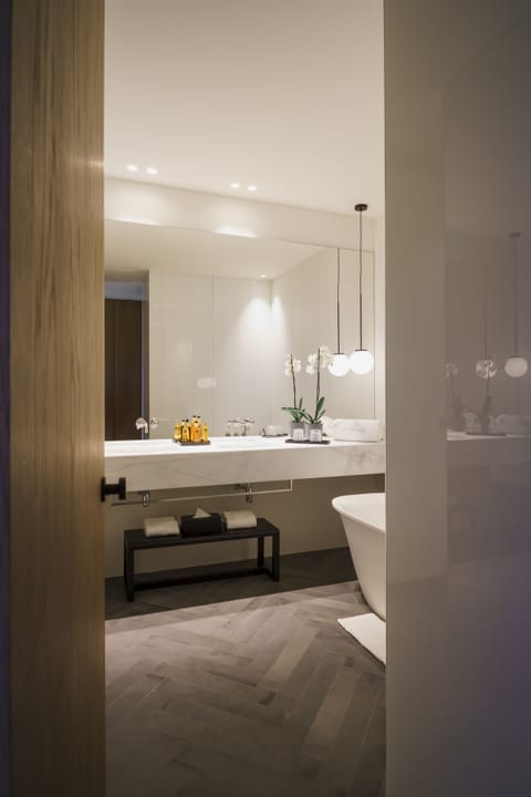 Junior Suite | Bathroom | Separate tub and shower, rainfall showerhead, hair dryer, bathrobes