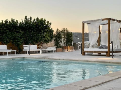 Seasonal outdoor pool, pool umbrellas, sun loungers