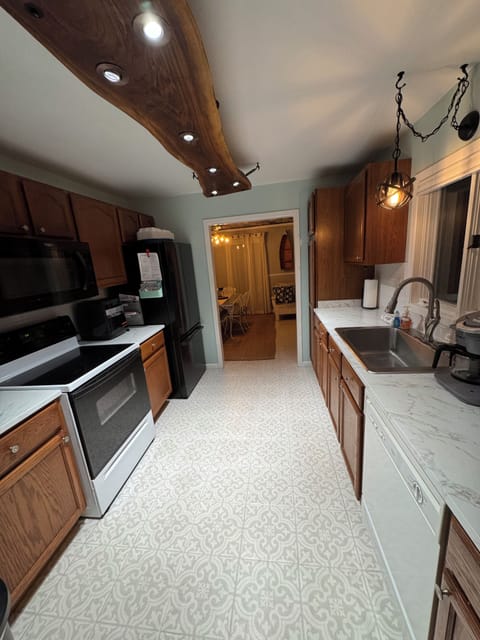 Kitchen is between the living area & dining room 