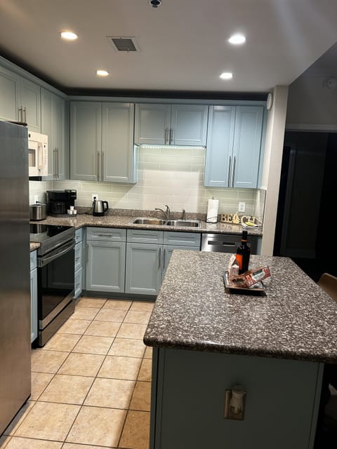 Updated kitchen with dimmable ceiling lights and custom under-the-cabinet lights
