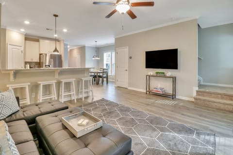 Spacious living room with 55" Roku TV and games