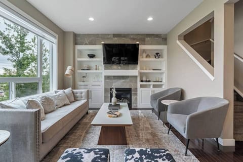 Welcome home! This is the formal living space off the living and dining room. This home offers two living spaces, each with ample seating, alluring décor and large TV's. 