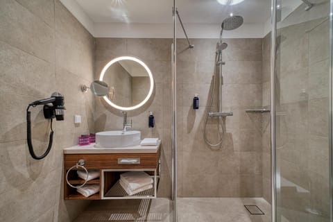 Shower, rainfall showerhead, hair dryer, towels