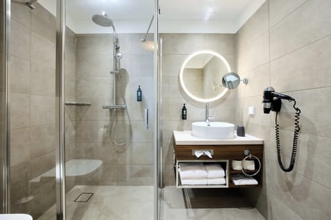 Shower, rainfall showerhead, hair dryer, towels