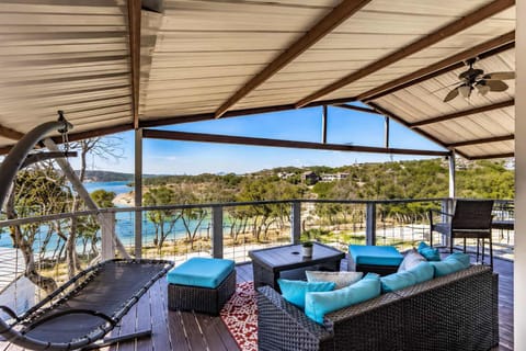 Enjoy lake views from the second-story patio, complete with extra seating.